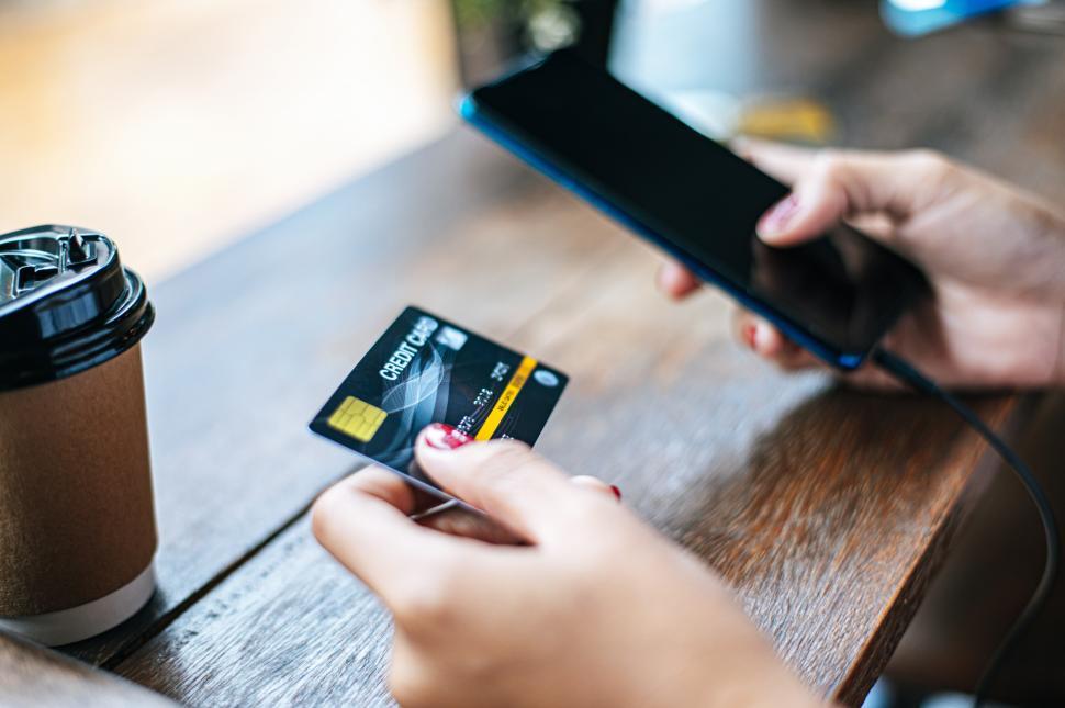 Free Image of Payment for goods by credit card via smartphone. 