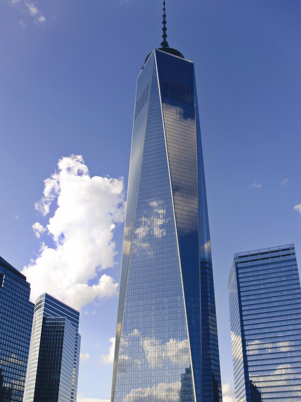 Free Image of Skyline view of One World Trade Center under a bright blue sky 