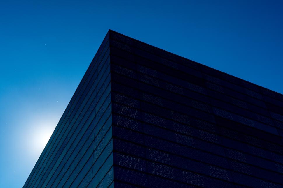 Free Image of Unique architectural structure against a vibrant blue sky at dusk 