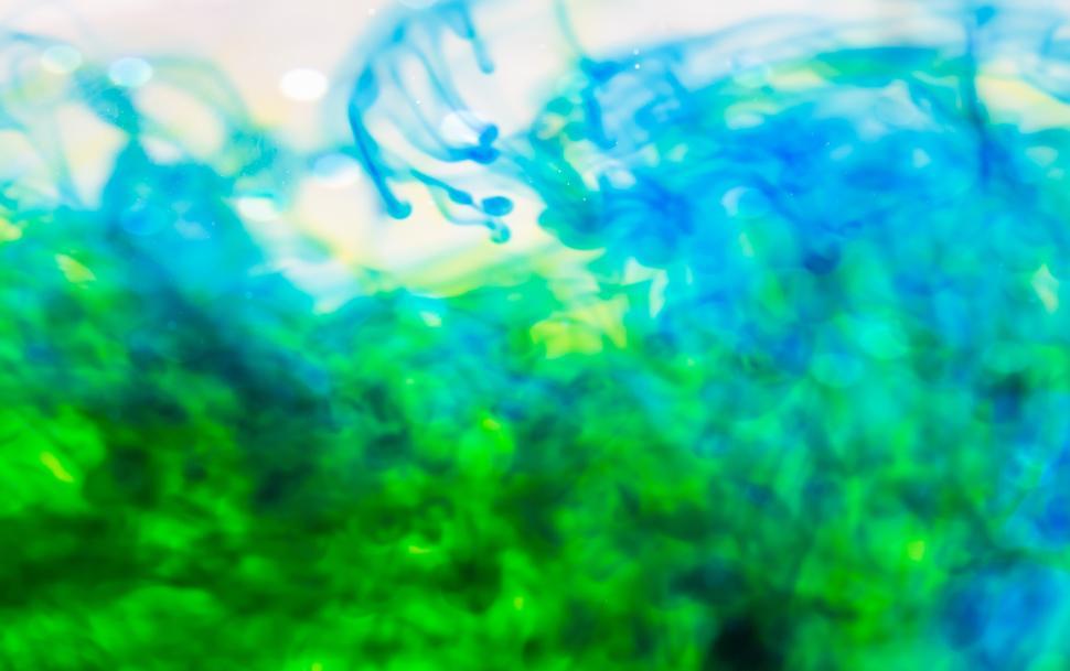Free Image of Colorful abstract patterns blend in vibrant hues of blue and green 