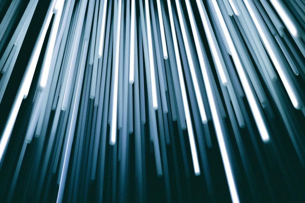 Free Image of Light beams create dynamic visual effect in dark space 