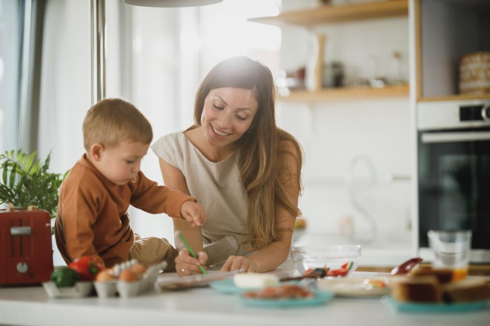 Free Image of Mother and child enjoying creative time together in the kitchen 