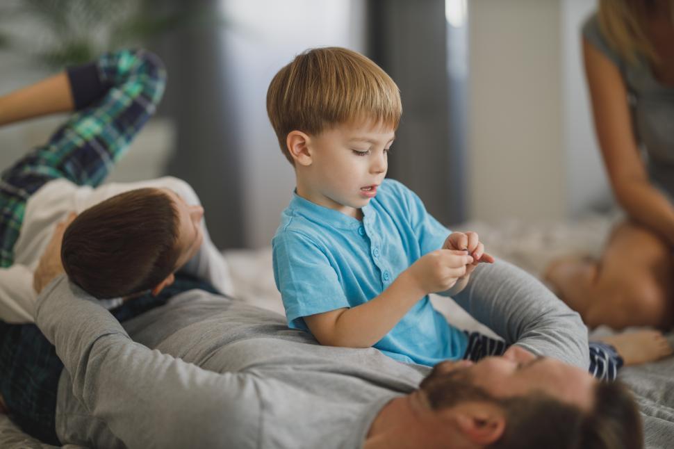 Free Image of Family enjoying quality time together in a cozy living room 