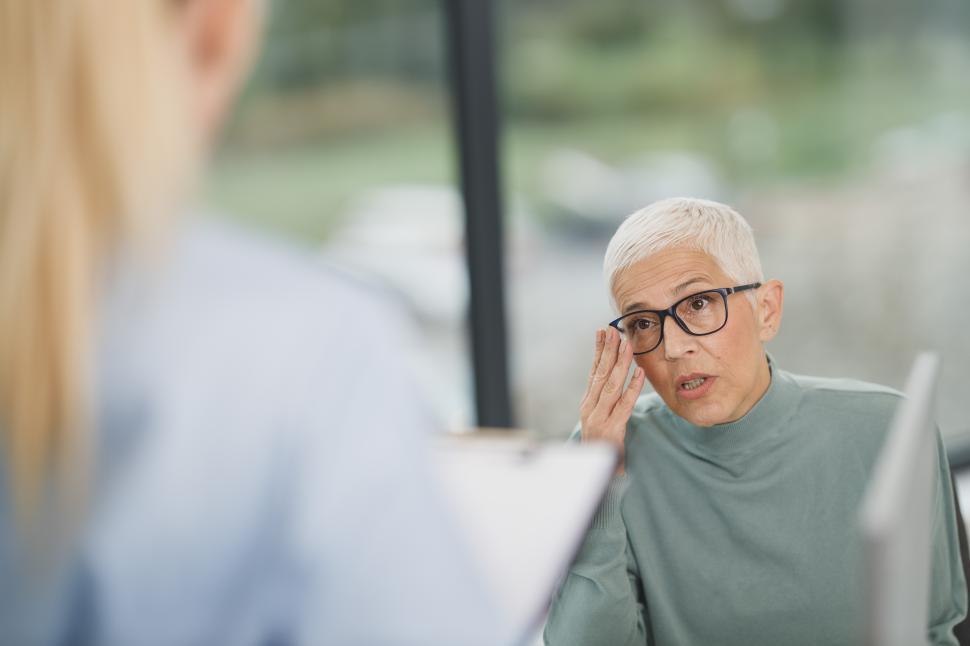 Free Image of Elderly woman consulting with a health professional indoors 