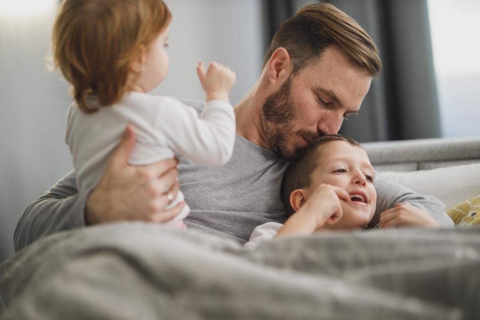 Free Image of Father bonding with children during cozy morning at home 