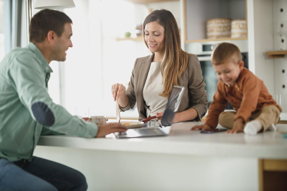 Free Image of Family enjoying breakfast together in a cozy kitchen setting 
