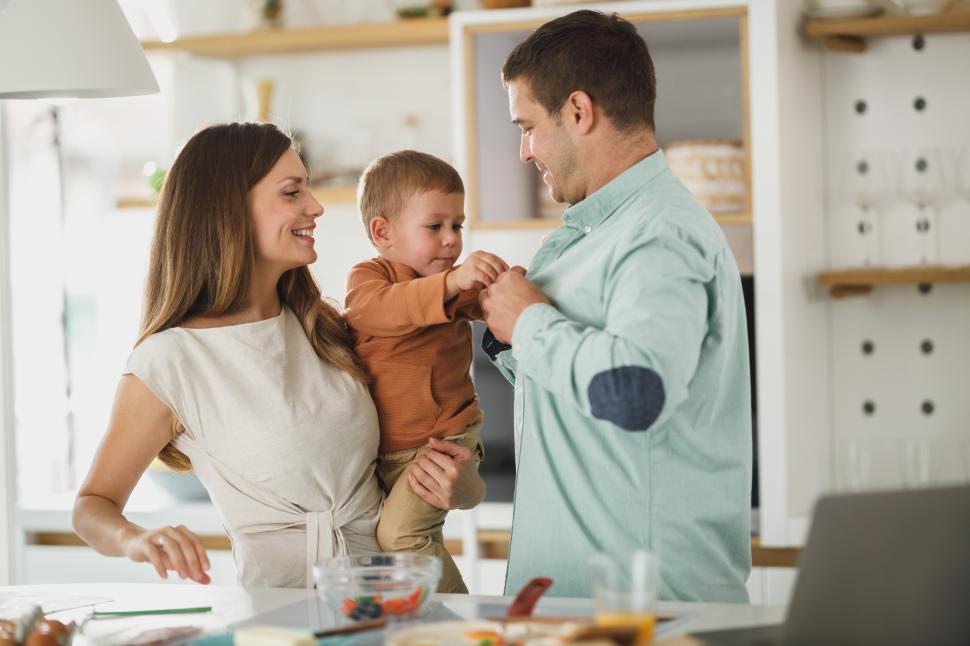 Free Image of Family enjoying time together in a bright kitchen 