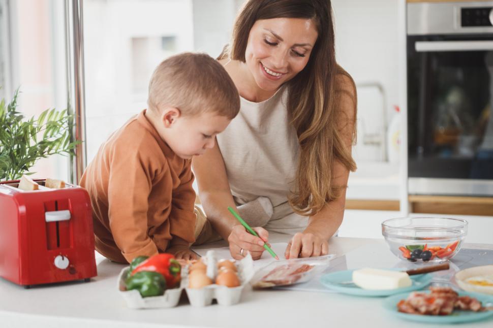 Free Image of Family cooking time with child in modern kitchen 