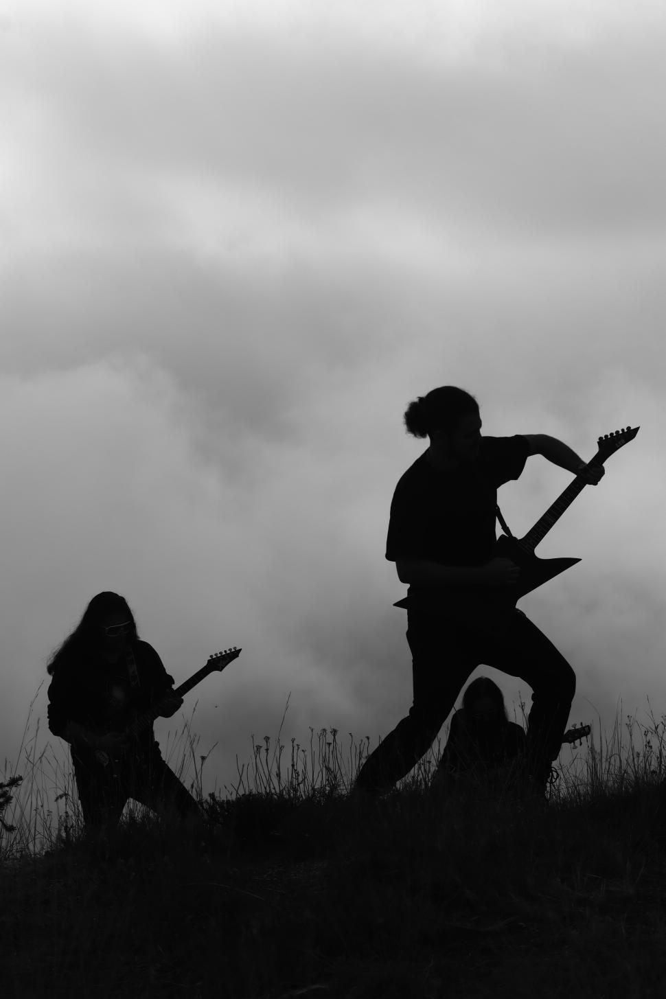 Free Image of A rock music artist performing - Iran-Mortaz band  