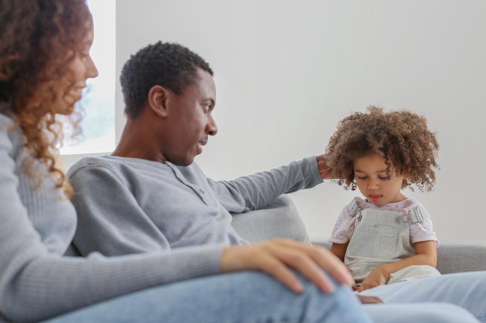 Free Image of Family sitting together and having a serious conversation 