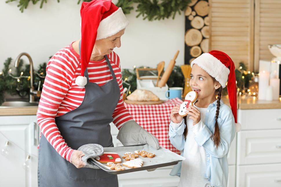 Free Image of Holiday baking with grandma and granddaughter in the kitchen 