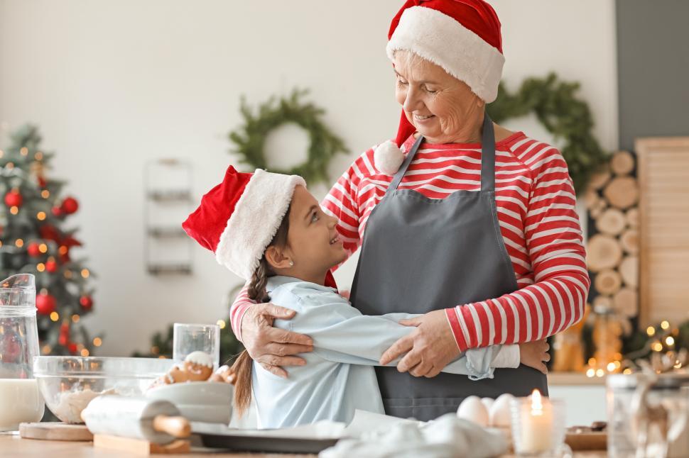 Free Image of Cooking holiday treats with grandma in festive kitchen 