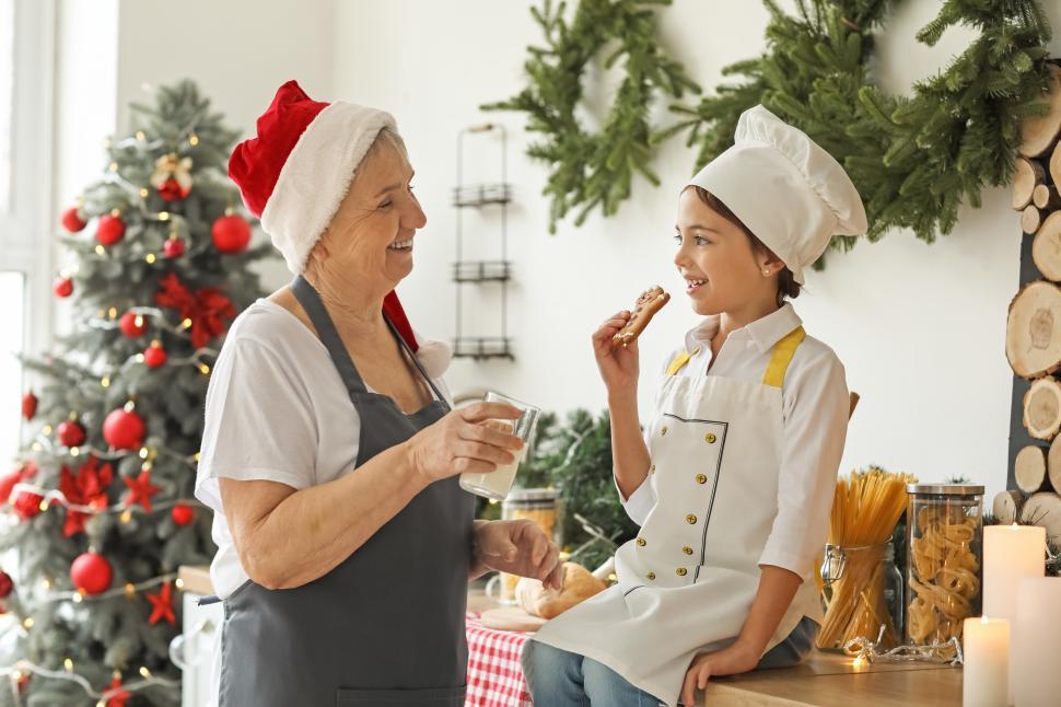 Free Image of Cheerful holiday baking with grandmother and child 