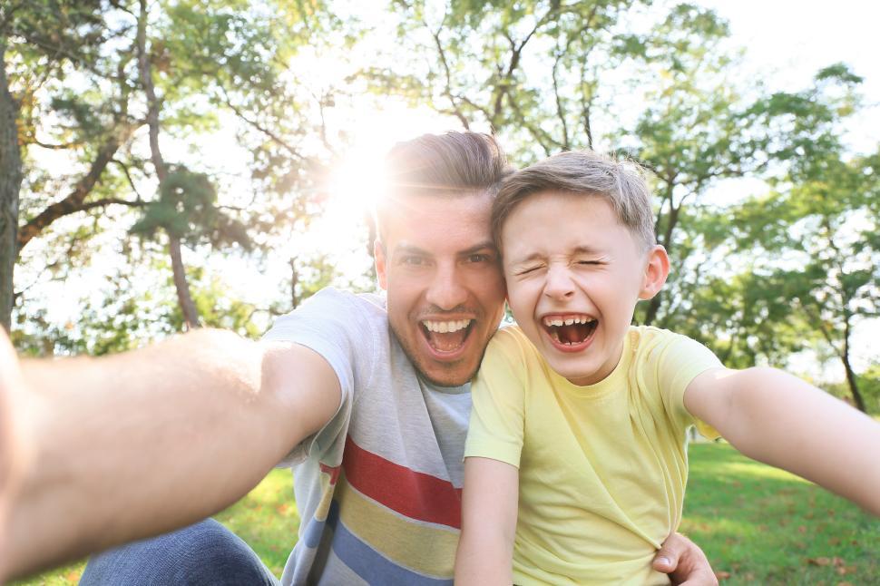 Free Image of Father and son enjoy a sunny day in the park 