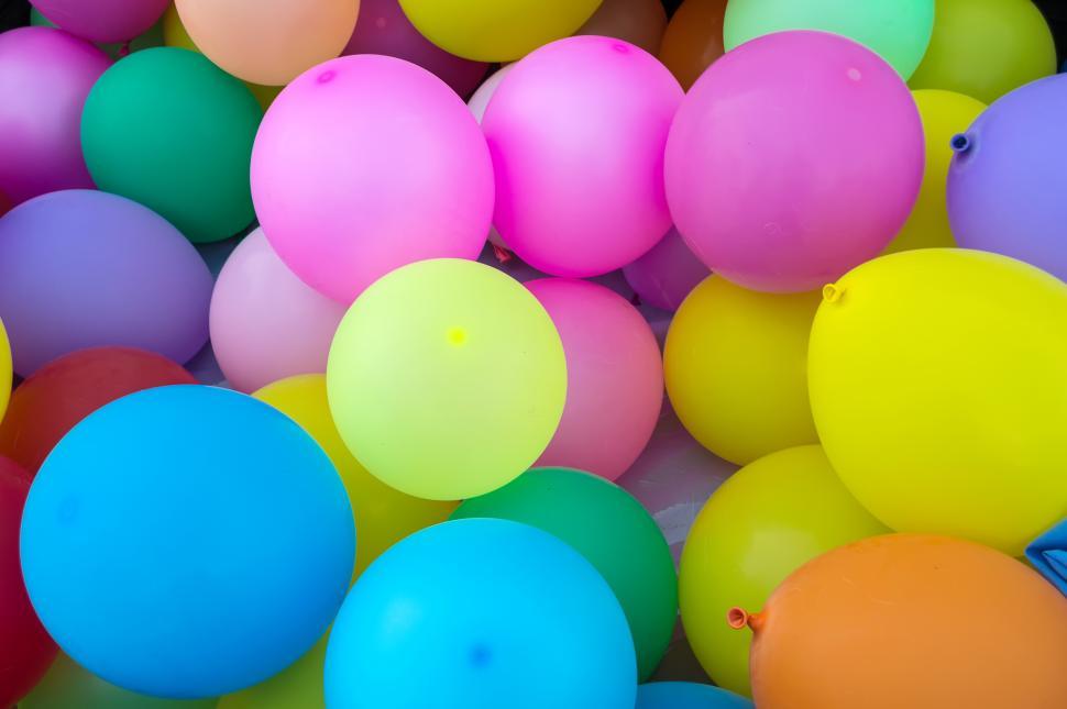 Free Image of Colorful balloons fill a space for celebration and joy 