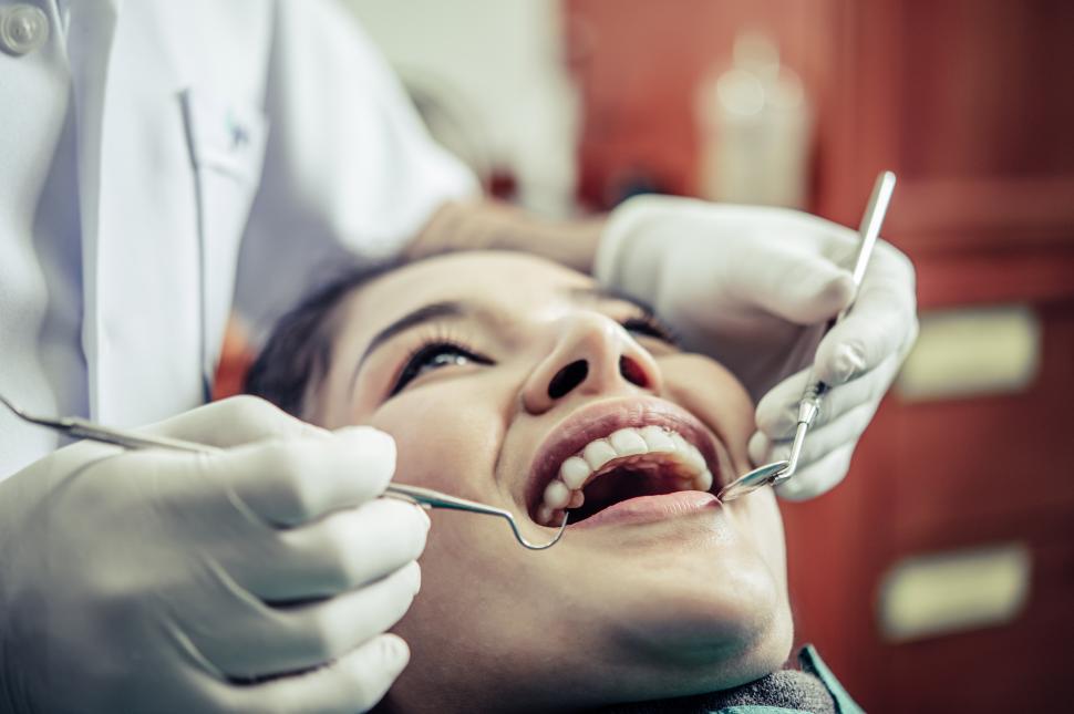 Free Image of Dentists treat patients  teeth. 