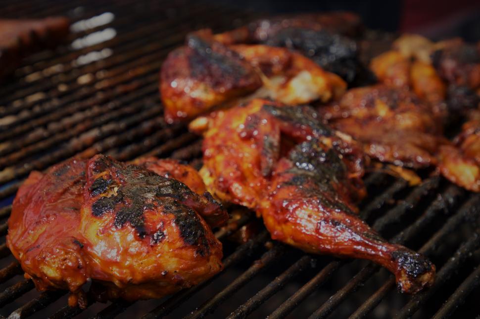 Free Image of Grilling savory chicken at a summer outdoor barbecue in the backyard 
