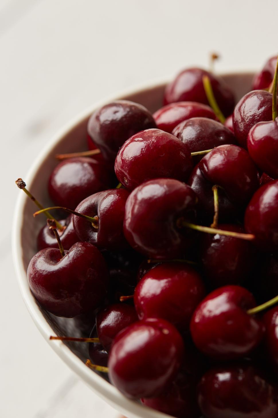 Free Image of Fresh cherries in a bowl ready for enjoyment 