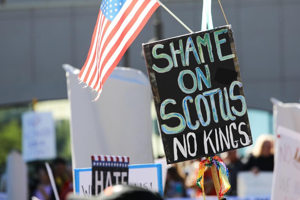 Free Image of Protest against Supreme Court decisions with signs and American flag 