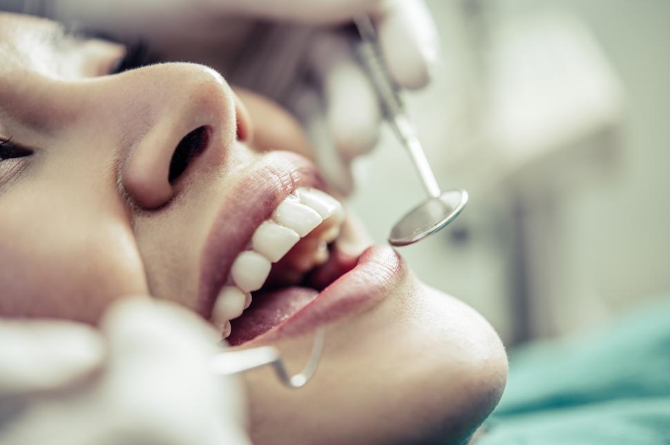 Free Image of Dentists treat patients  teeth. 