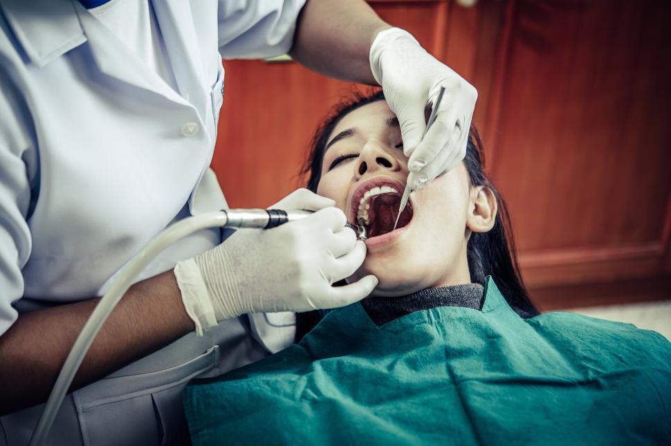 Free Image of Dentists treat patients  teeth. 