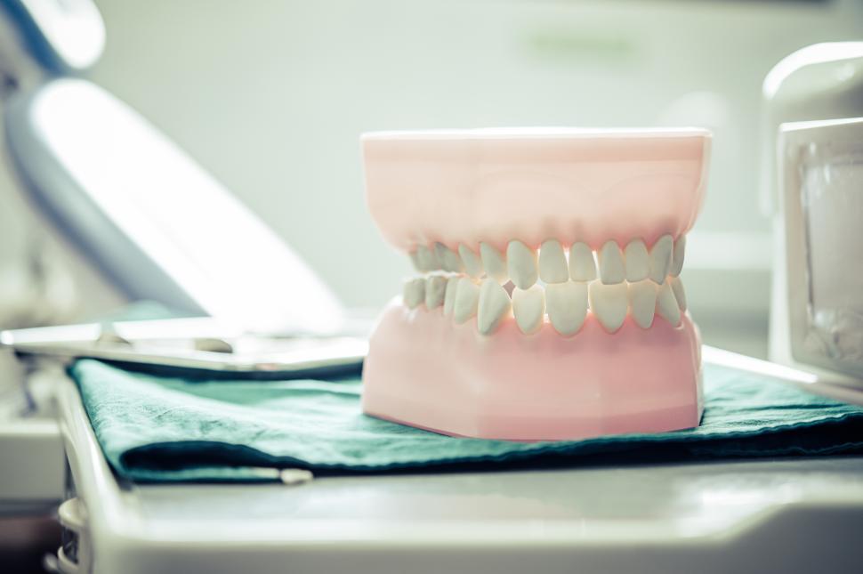 Free Image of Dentures placed on a table in the laboratory 