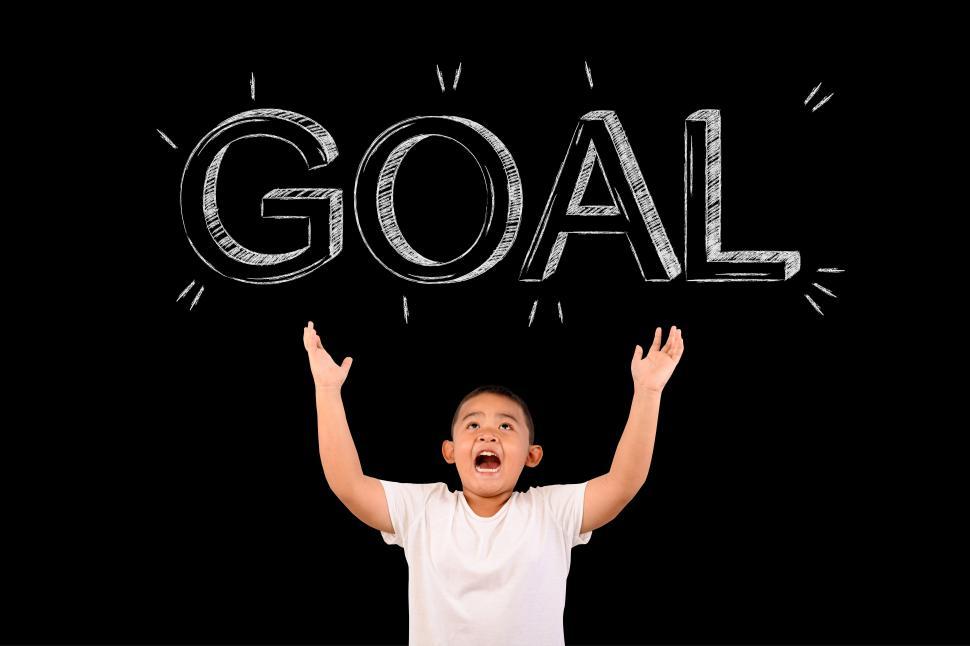 Free Image of The boy spread his hand to show the goal 