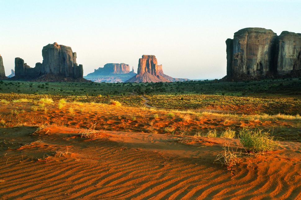 Free Image of Desert Landscape With Mountain in Background 