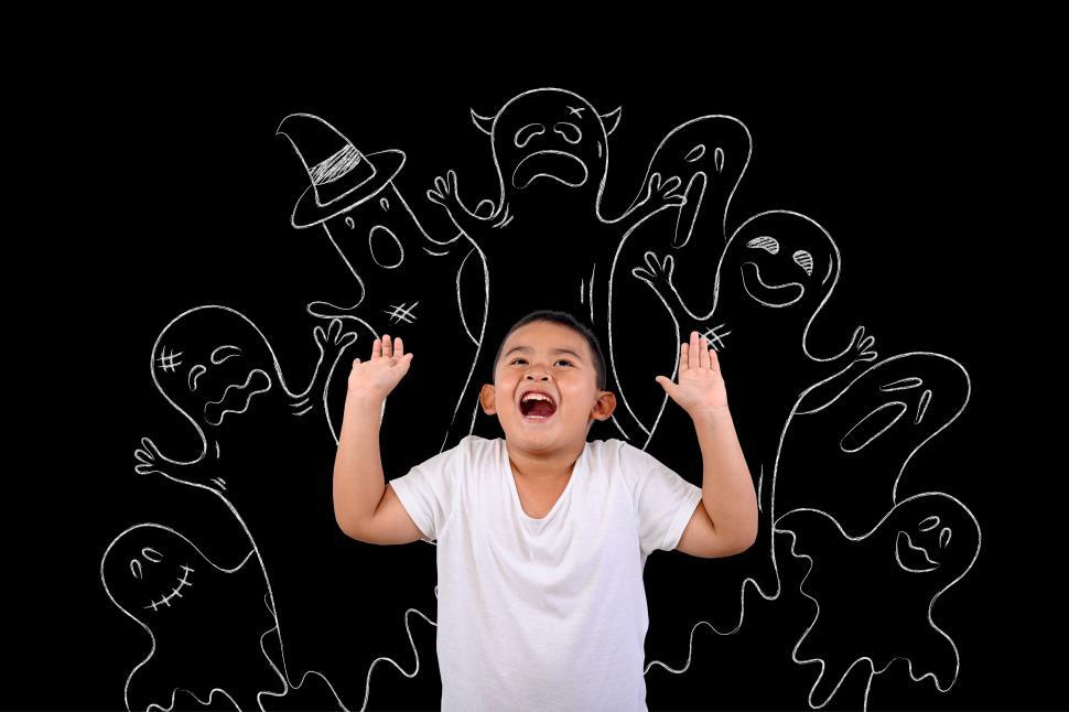 Free Image of The boy stood scared of many ghosts wanted 