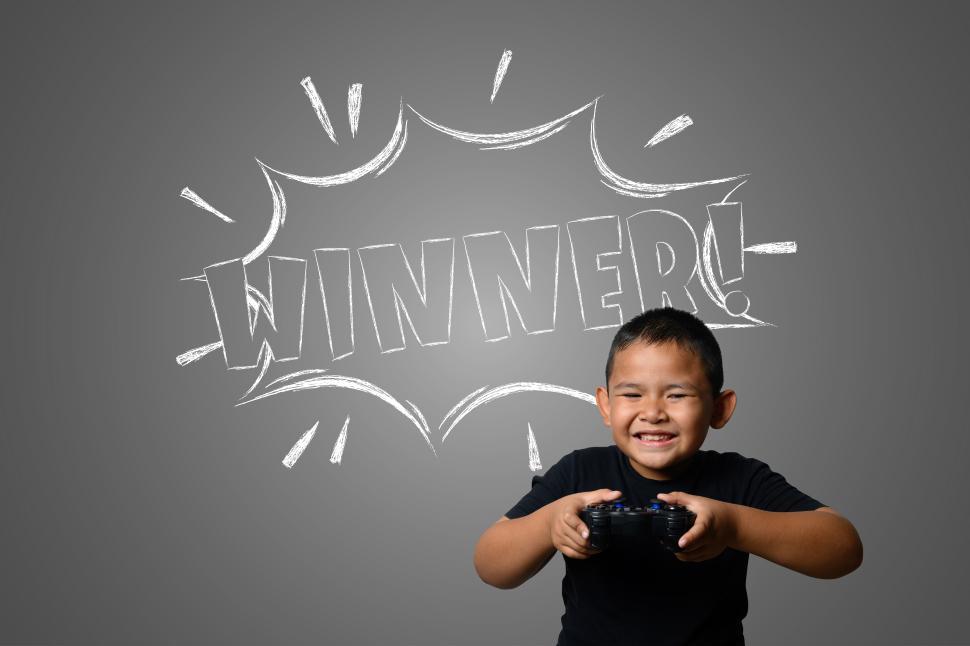Free Image of The boy plays fun Strategy Games. 