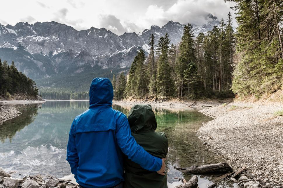 Free Image of Couple savoring peace by the mountain lake 