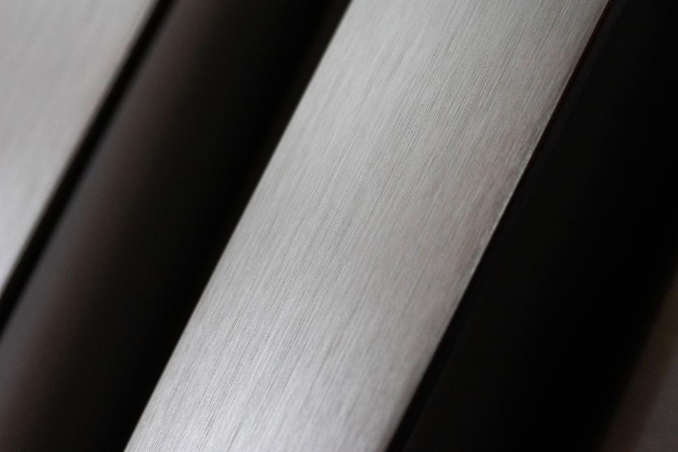 Free Image of Close-up view of brushed metal surface showing texture and detail 