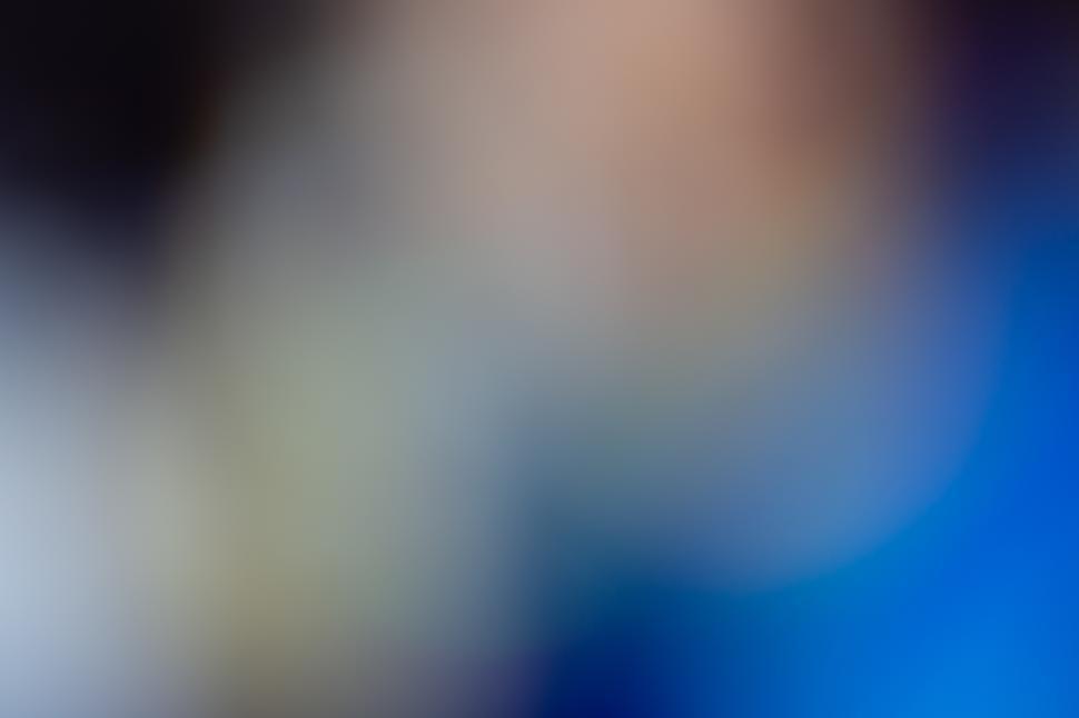 Free Image of Colorful abstract background with blurred patterns and soft shapes in vibrant hues 