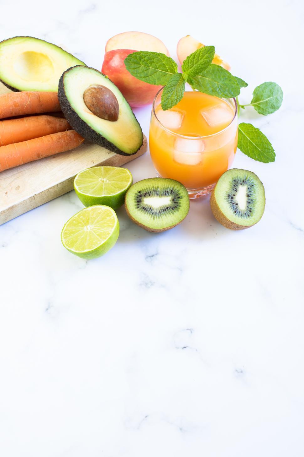 Free Image of Fresh fruit and vegetable arrangement with a drink 