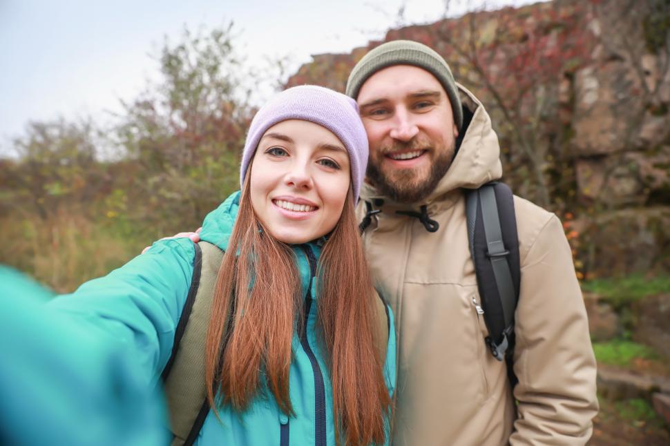 Free Image of Couple enjoying a hike together in nature during cool weather 