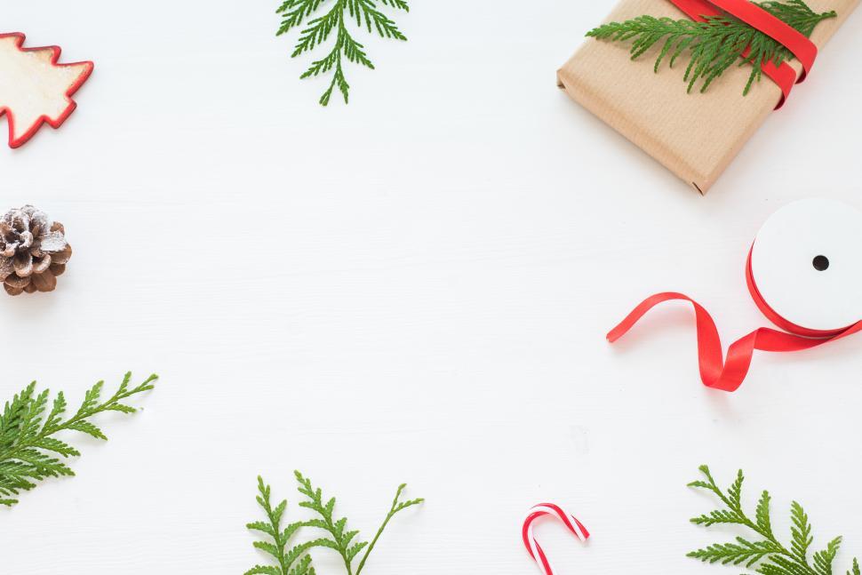 Free Image of Decorative Christmas arrangement with gifts and greenery 