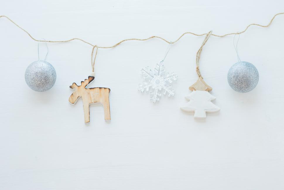 Free Image of Decorative holiday ornaments and decorations on string 