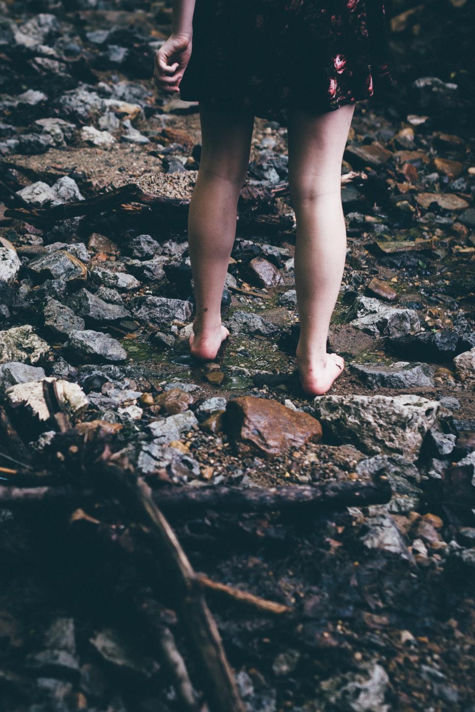 Free Image of Barefoot exploration in a rocky creek during afternoon 