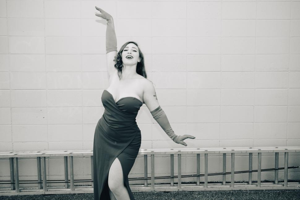 Free Image of Dancer in elegant dress performing in urban setting during the day 
