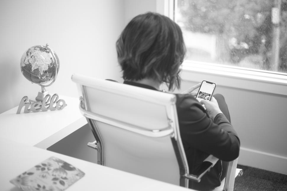 Free Image of Person using smartphone while sitting in modern office 