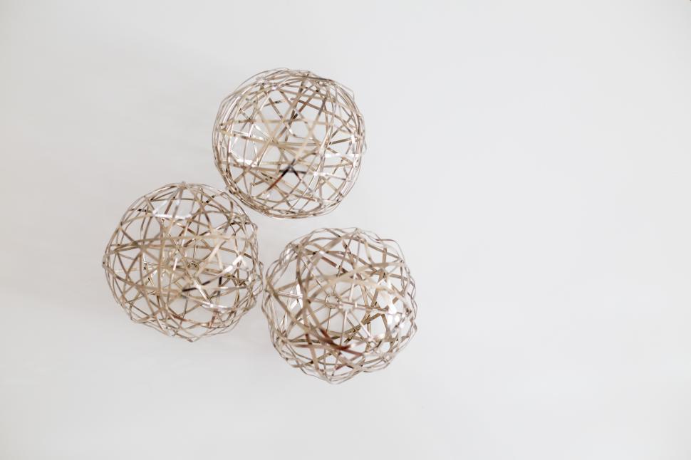 Free Image of Decorative woven spheres arranged on a light background in a modern setting 