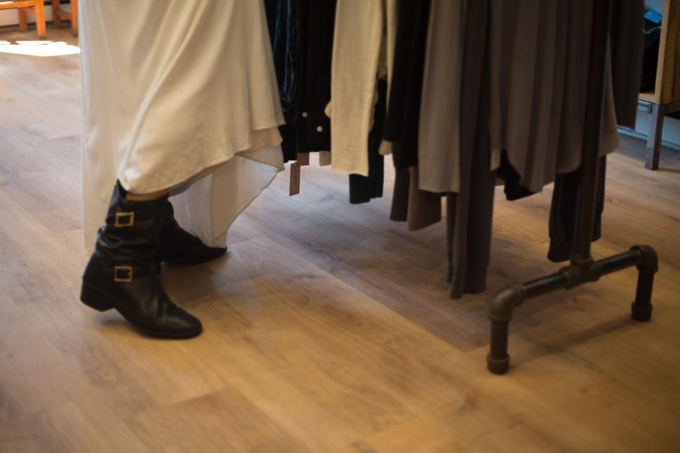 Free Image of Fashionable shopping indoors with stylish boots and garments 