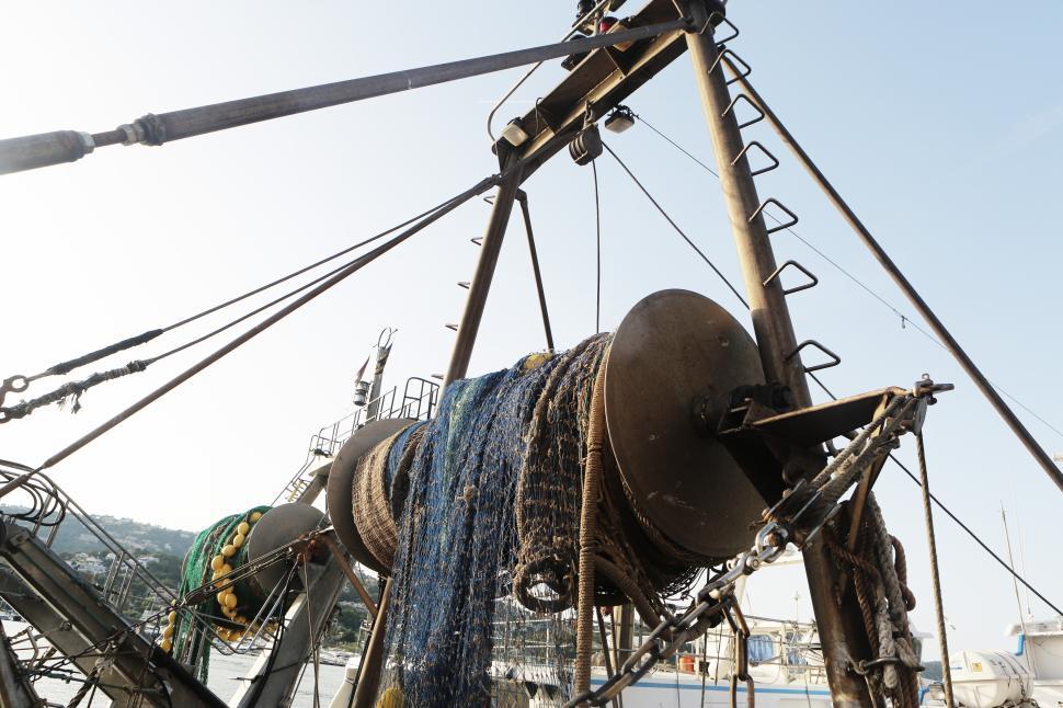 Free Image of Fishing equipment on a boat at the harbor during sunset 