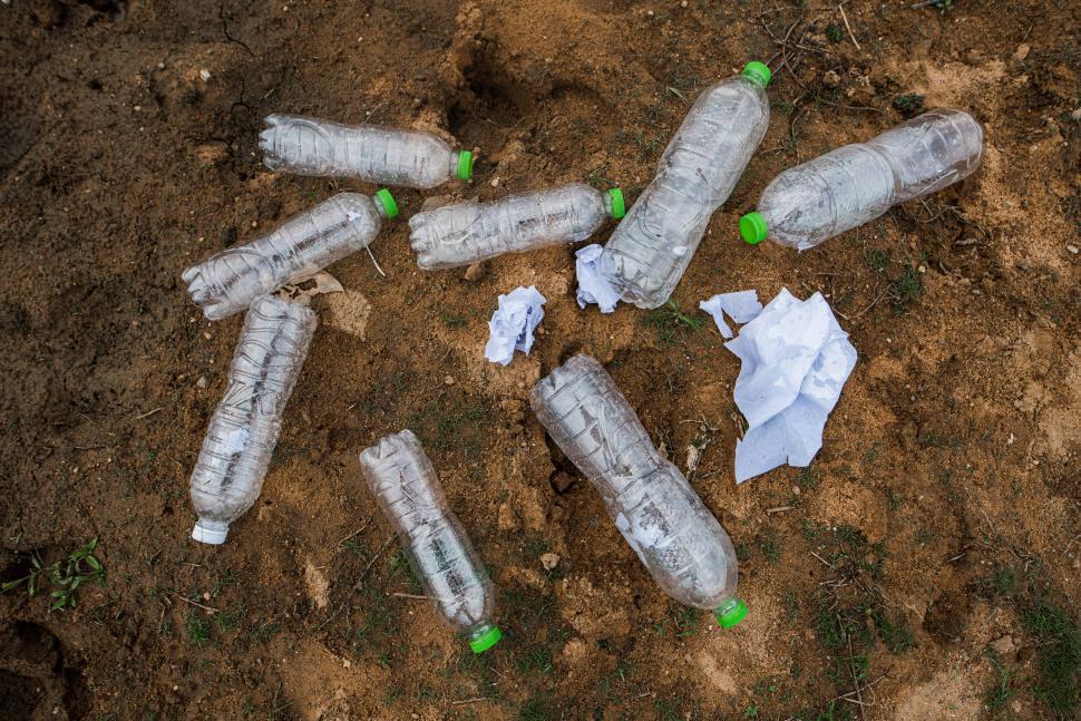 Free Image of A lot of water bottles are on the floor. 