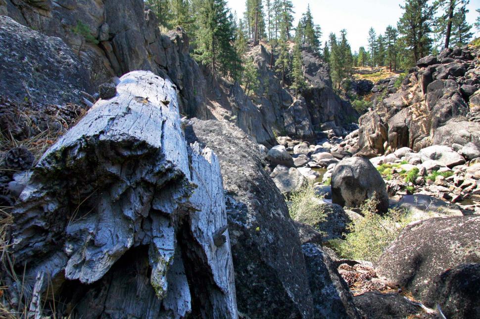 Free Image of Large Rock in the Middle of a Mountain 