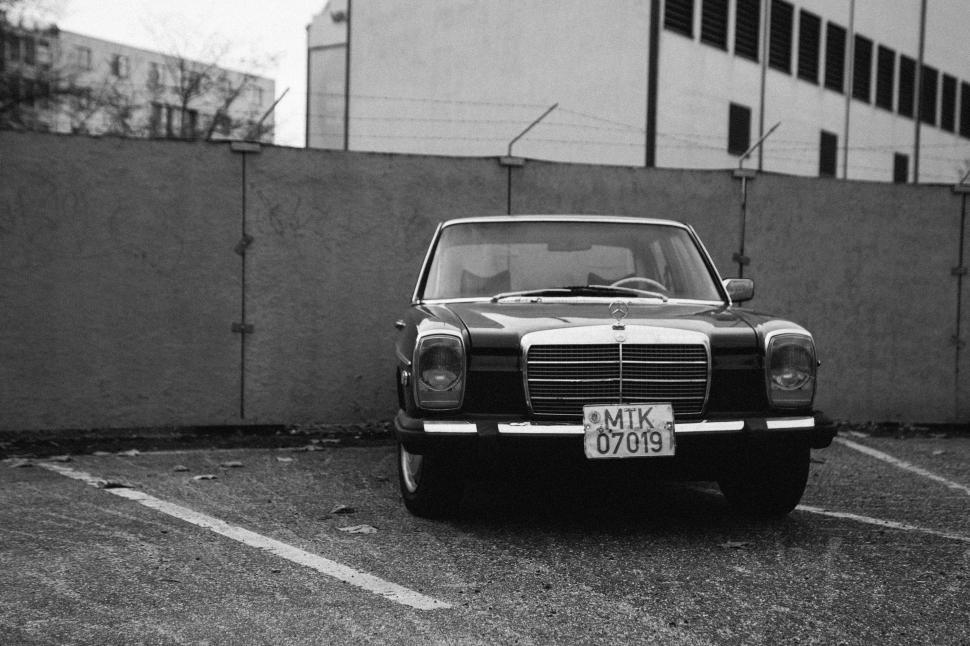 Free Image of Classic vintage car parked in an urban setting 
