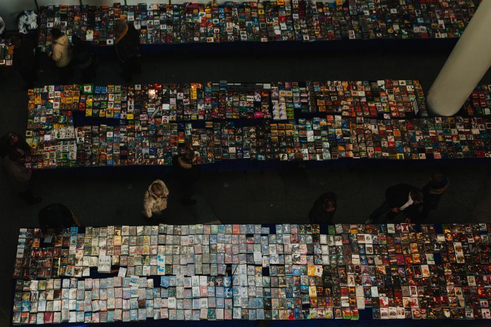 Free Image of Crowded market with diverse DVDs and CDs for sale 
