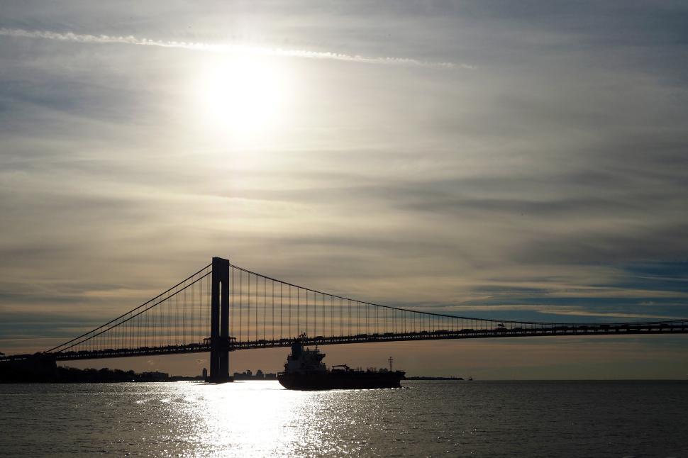 Free Image of Cargo Ship Under Bridge 