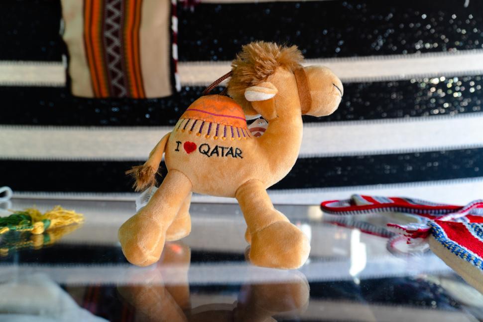 Free Image of Plush camel souvenir with Qatar branding  