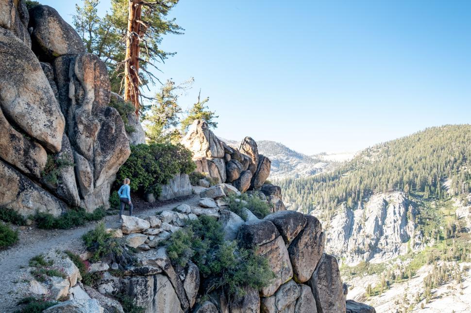 Free Image of Hiker explores rocky pathway in scenic mountain landscape 